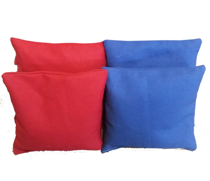 Four solid color cornhole bags, two red and two blue