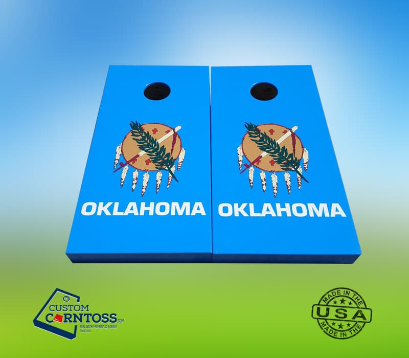 Custom wood cornhole boards with the blue Oklahoma state flag design